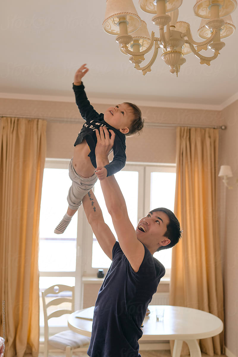 Man Holding His Child Above