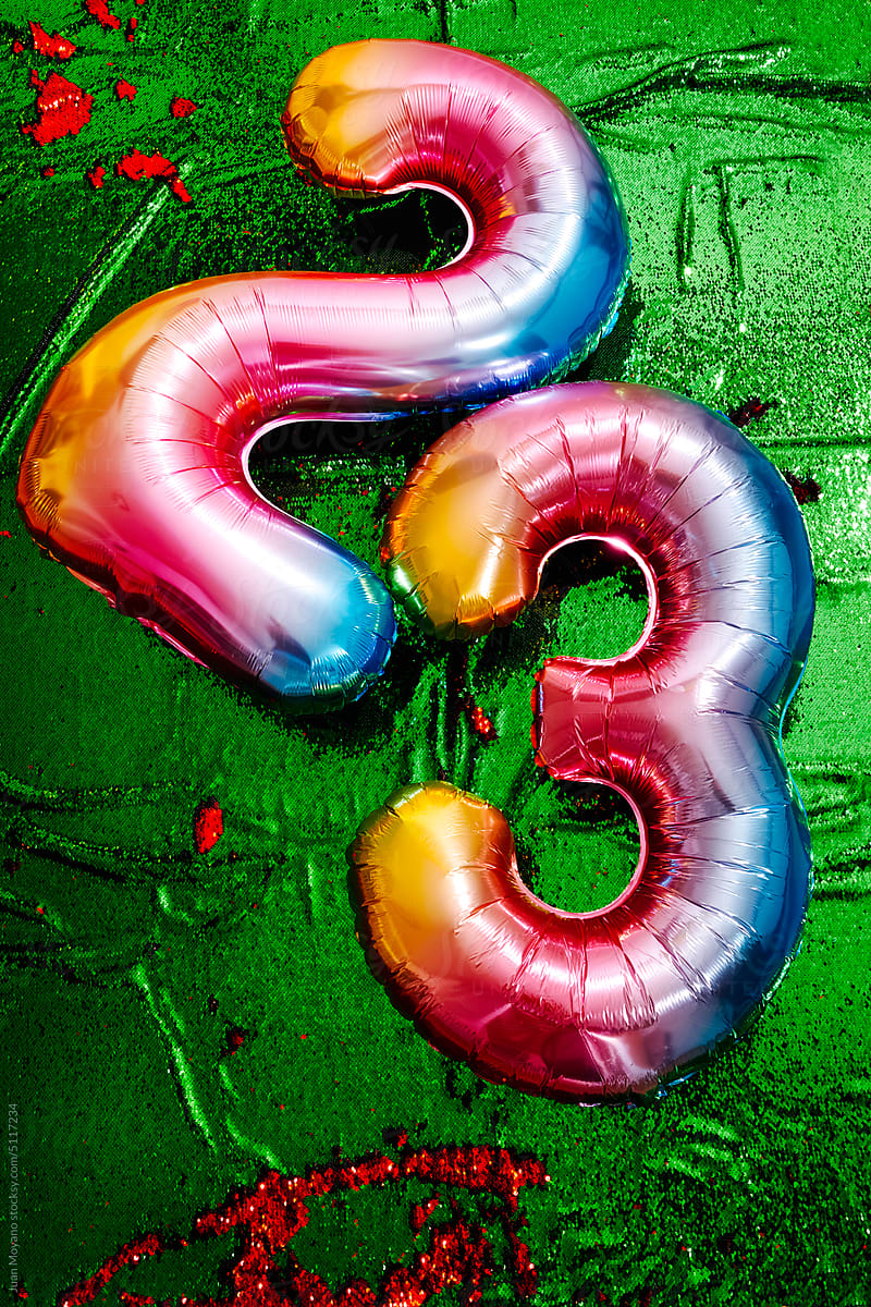 two number-shaped balloons form the number 23
