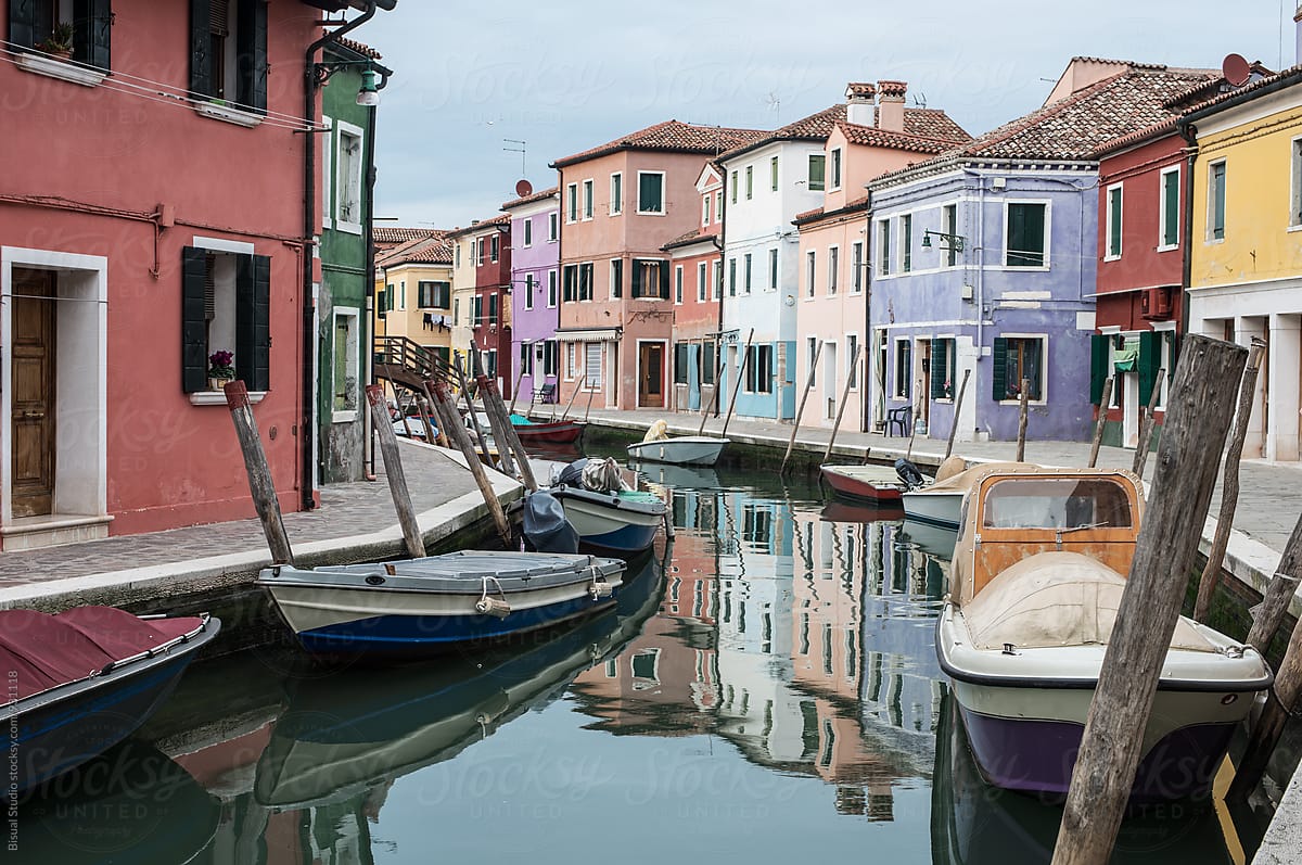 Colorful street with a canal in Burano