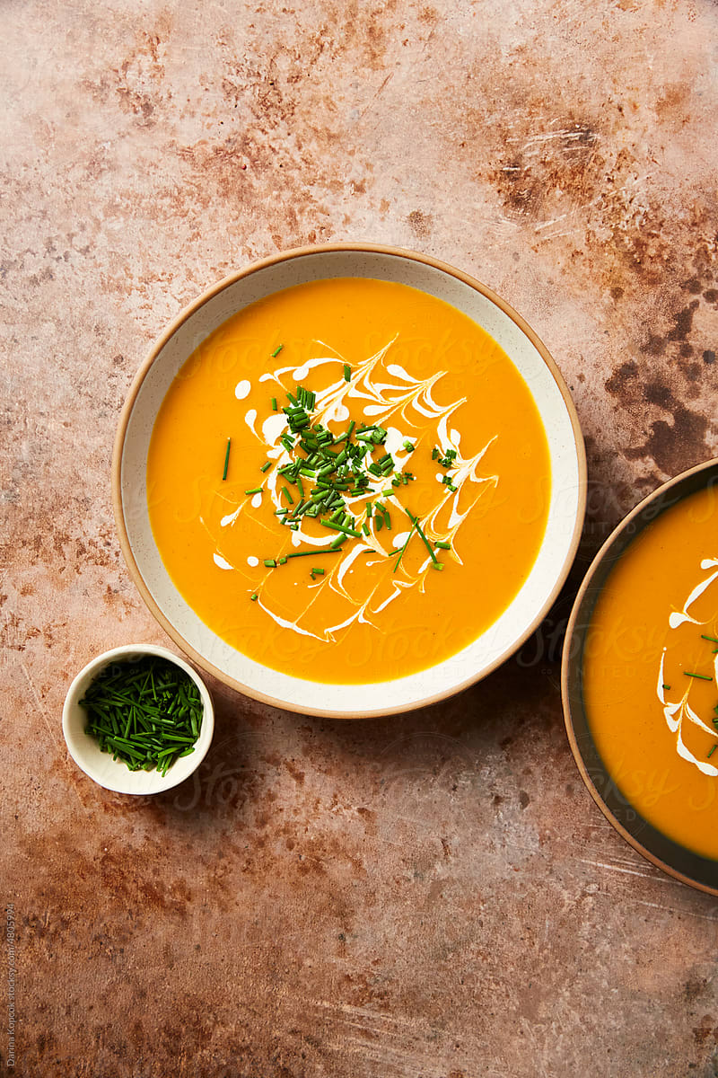 Two Servings of Butternut Squash Soup Served with Chives
