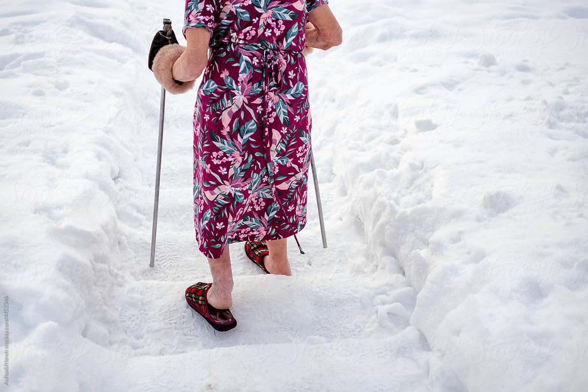 mature woman walking in the snow