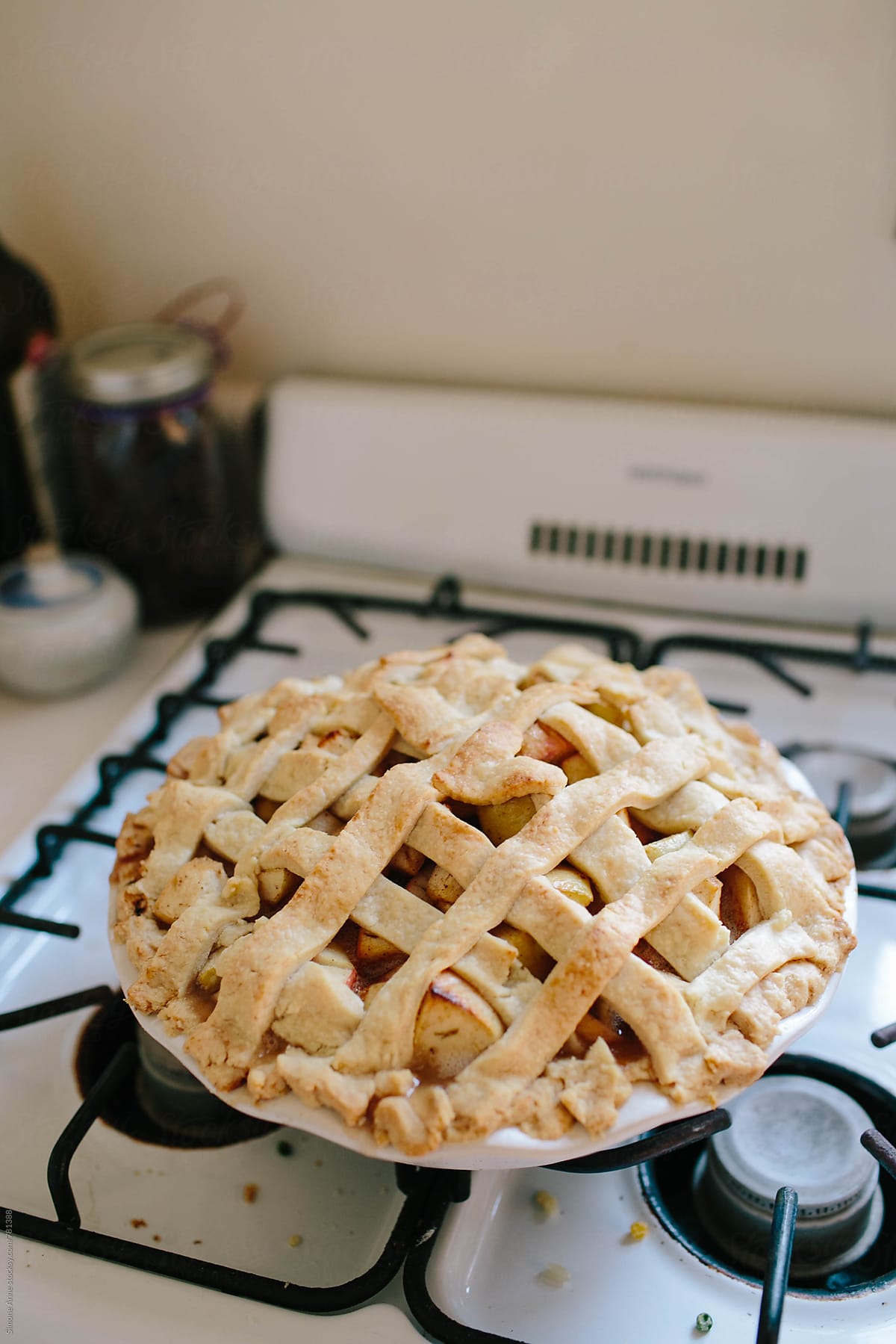 Baked apple pie sits on stove top