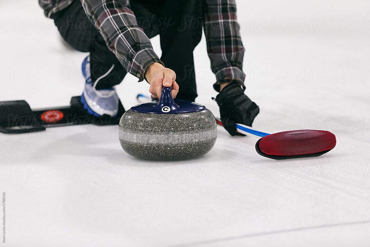 Curling: Male Thrower About To Push Off From Hack