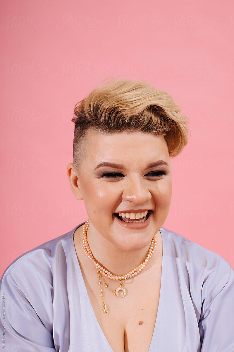 Laughing blond woman with short trendy haircut