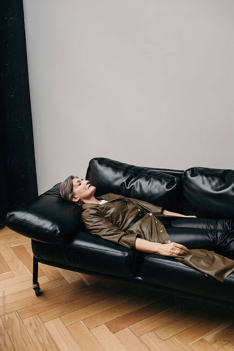Senior woman sleep on sofa