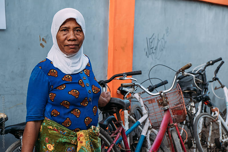Indonesian old woman runs a bike rent business on Gili islands