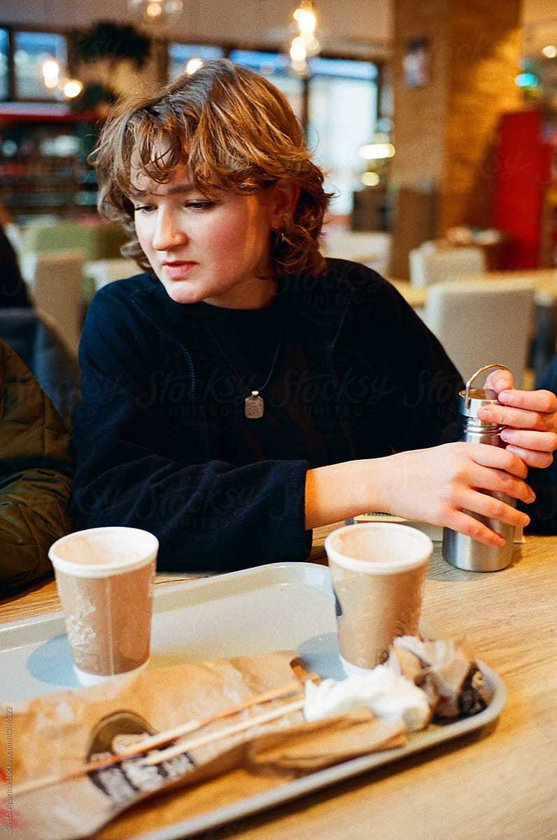Portrait of young woman in a coffee shop.