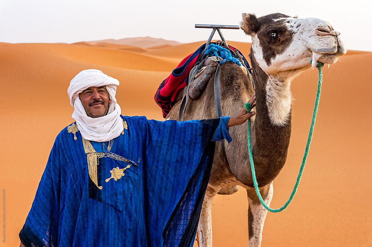 Portrait of a Berber and camel in the Sahara Desert