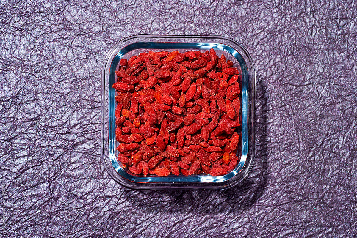 dried goji berries in a glass container