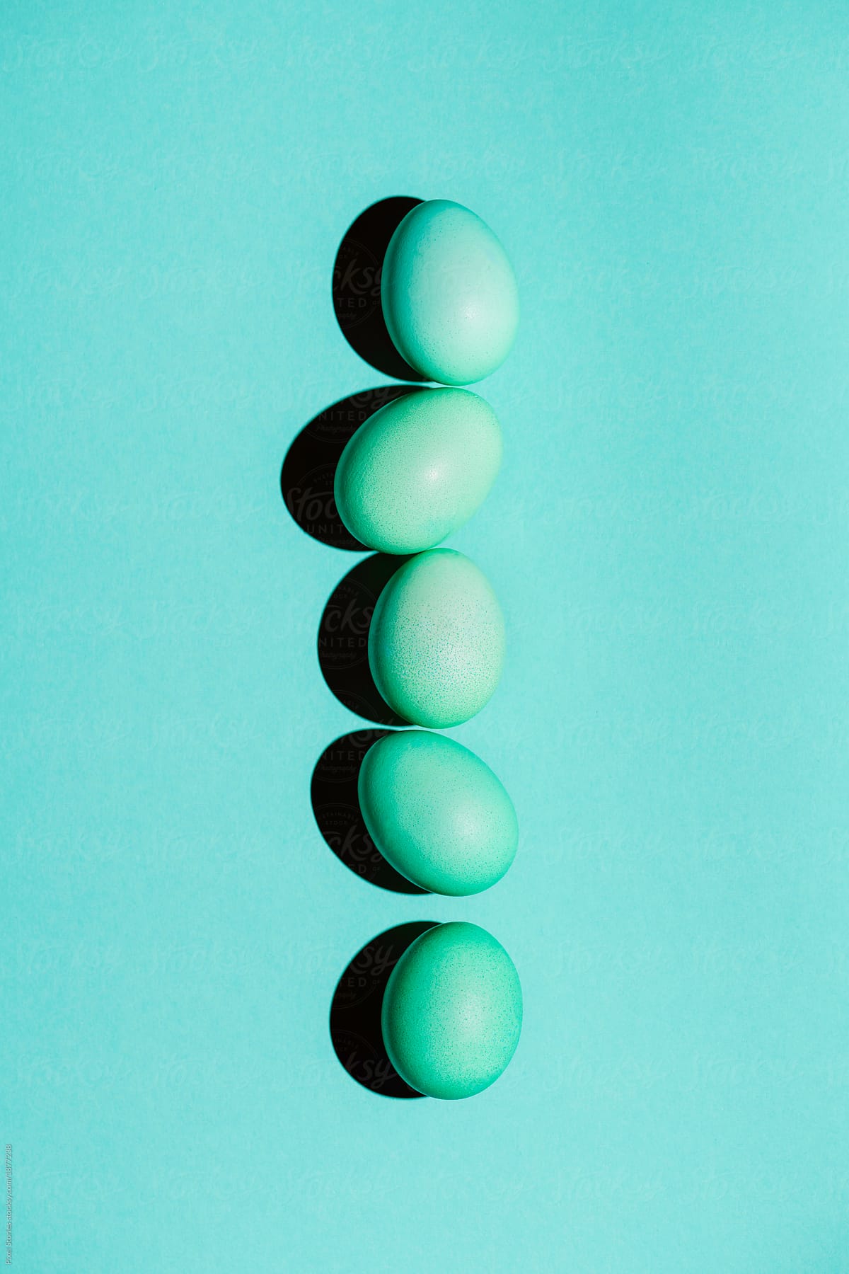 Turquoise Easter eggs with bold colors and shadows