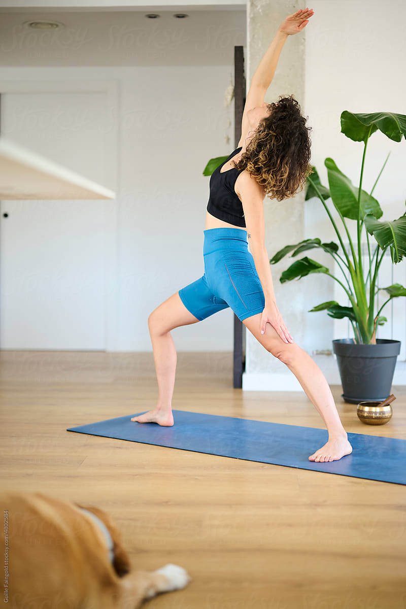 Slim Woman Performing Asana At Home. by Stocksy Contributor Guille  Faingold - Stocksy