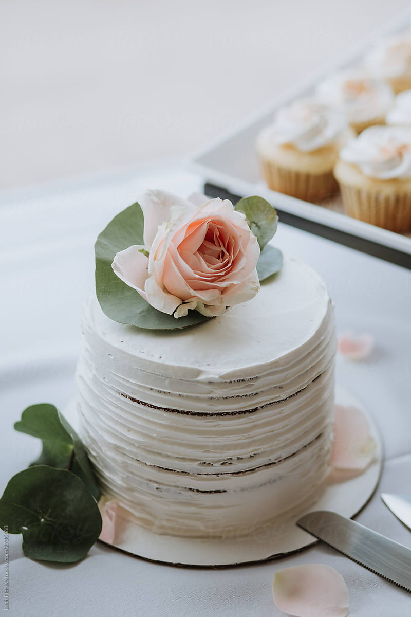 Wedding Cake and Cupcakes in Background