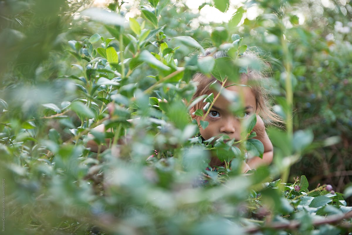 Girl Hiding In A Bush