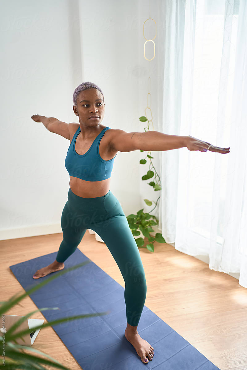 Woman doing Warrior yoga pose