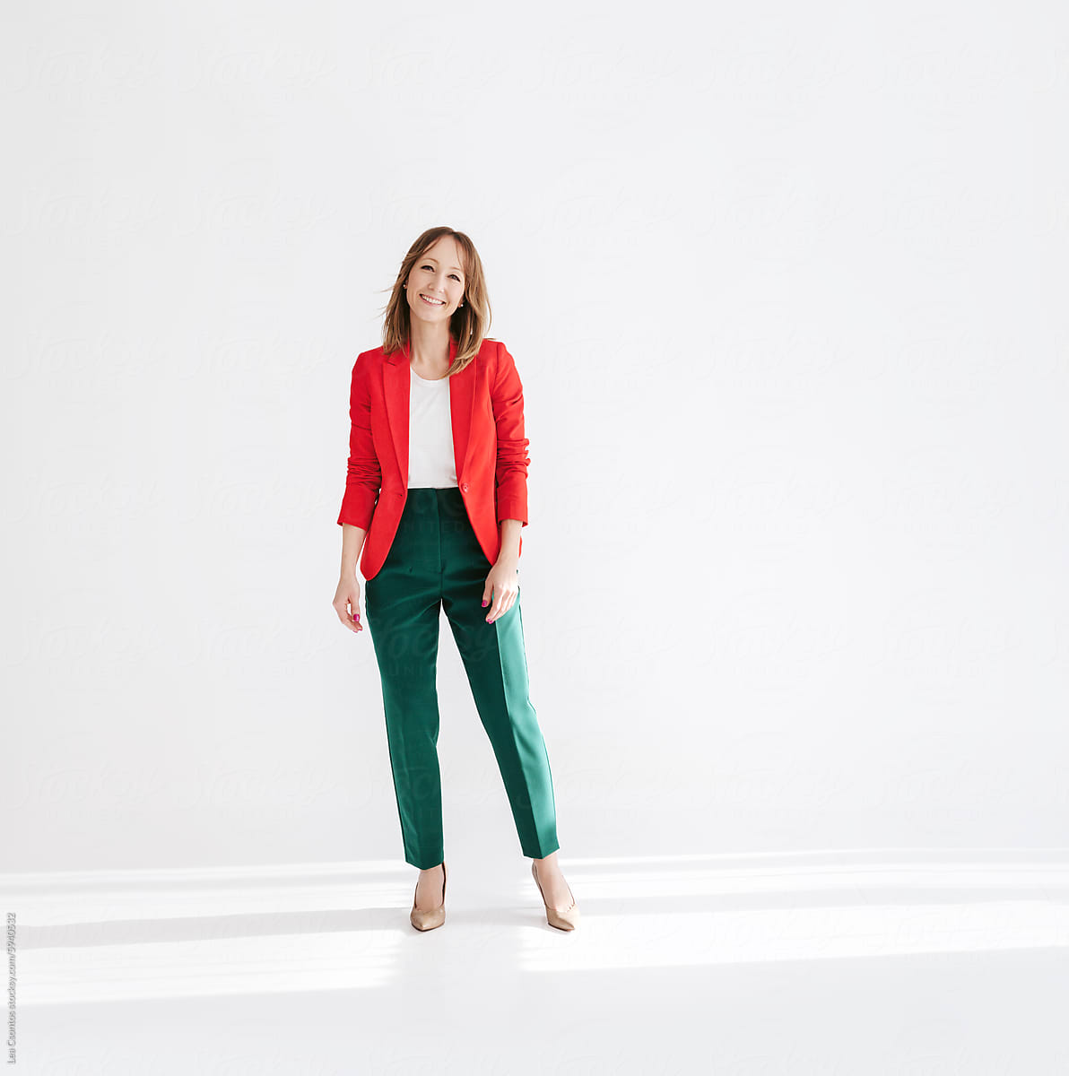 Portrait of a fashionable and confident woman wearing bold colors.