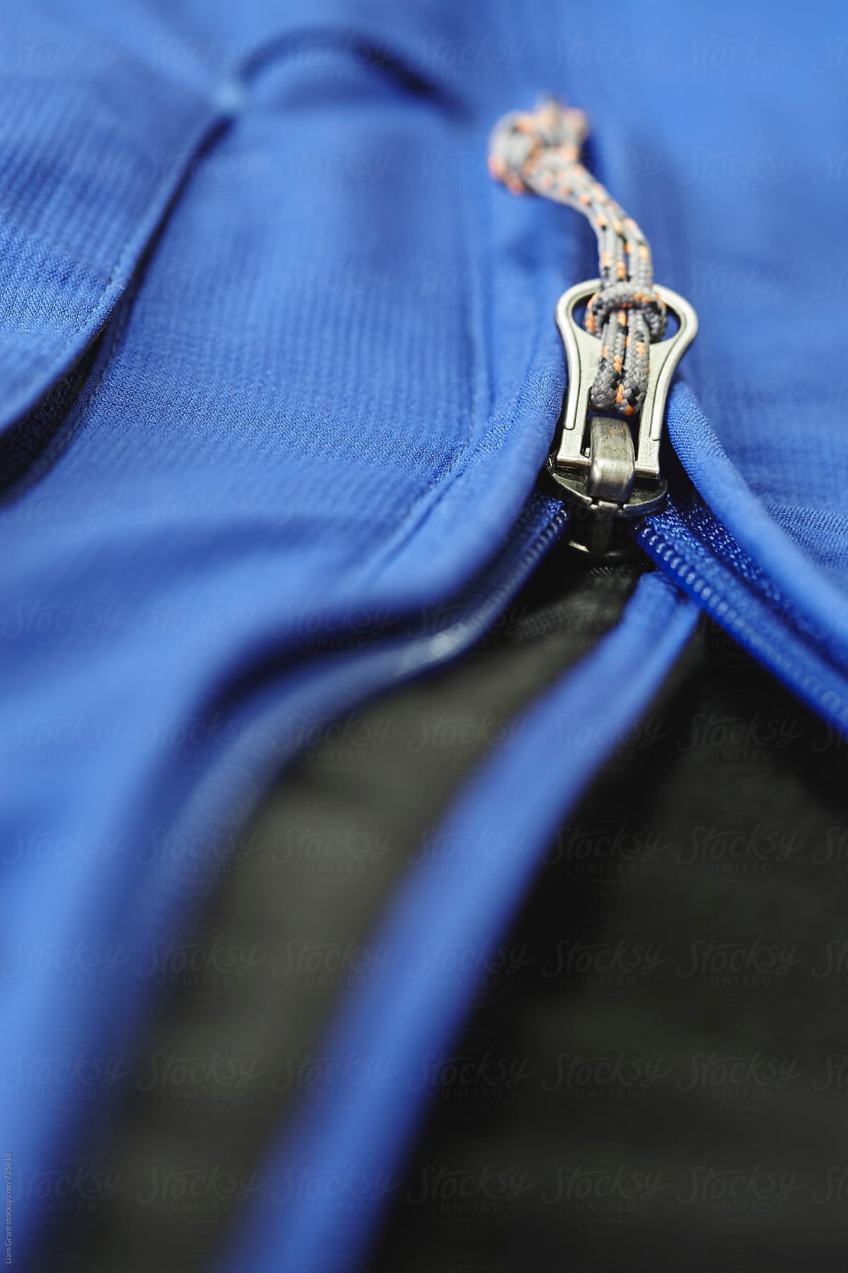Windproof zip and fabric of a softshell mountaineering jacket.