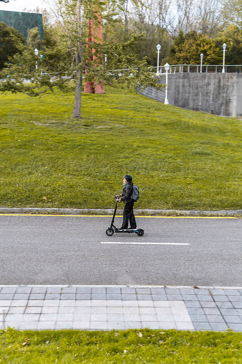 Woman riding e-scooter
