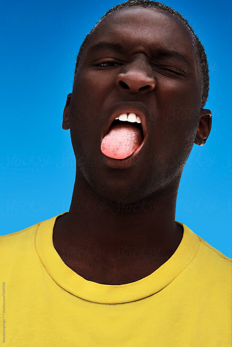 African American man sticking out his tongue.