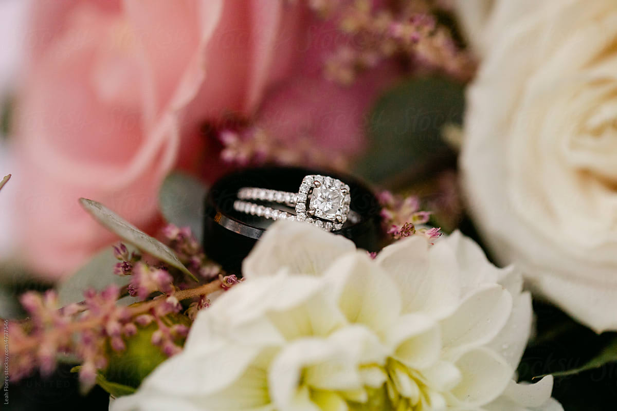 Closeup of Diamond Ring and Wedding Band in Bouquet