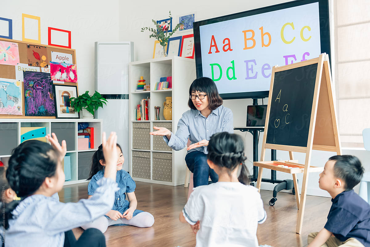 Teacher and preschool kids in classroom