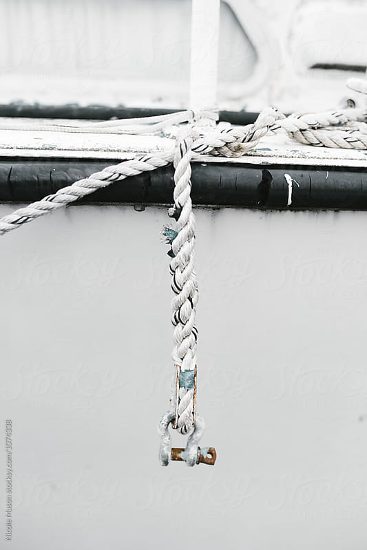 detail of rope hanging off of boat