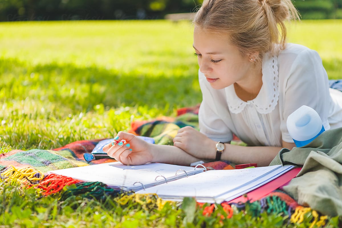 Teenage Girl Studying at the Park