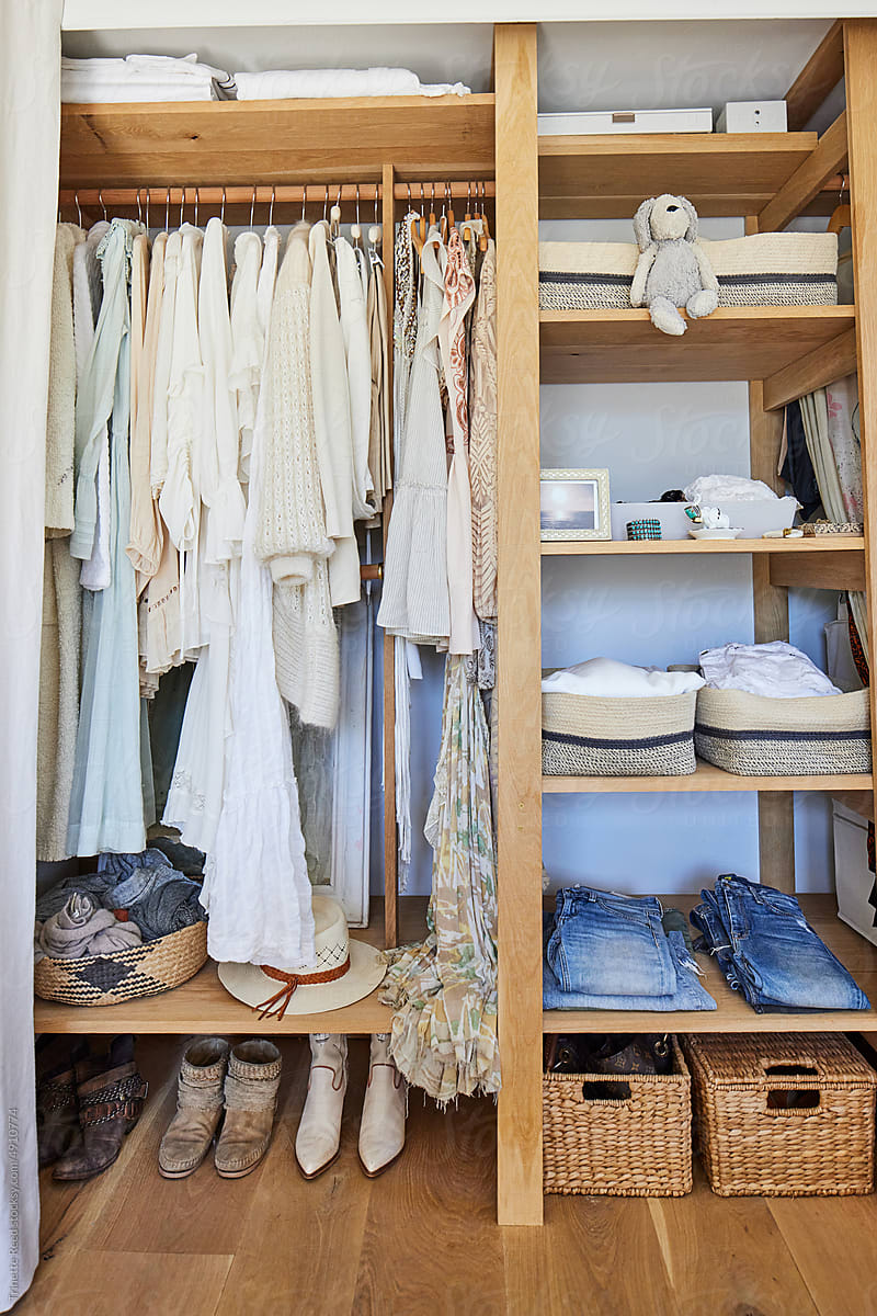 Woman\'s closet with clothes