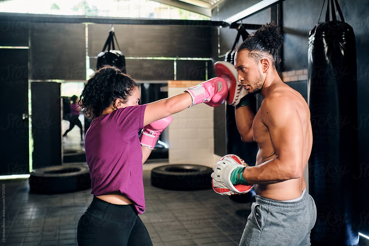 Latin couple practicing boxing