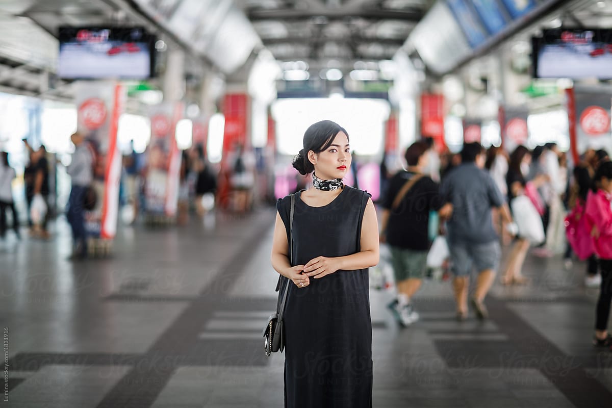 Woman Standing at Metro Station