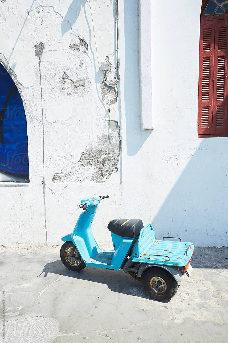 A Weathered Turquoise Moped Sits In A White Alleyway In Mykonos by Stocksy Contributor Fortin" - Stocksy