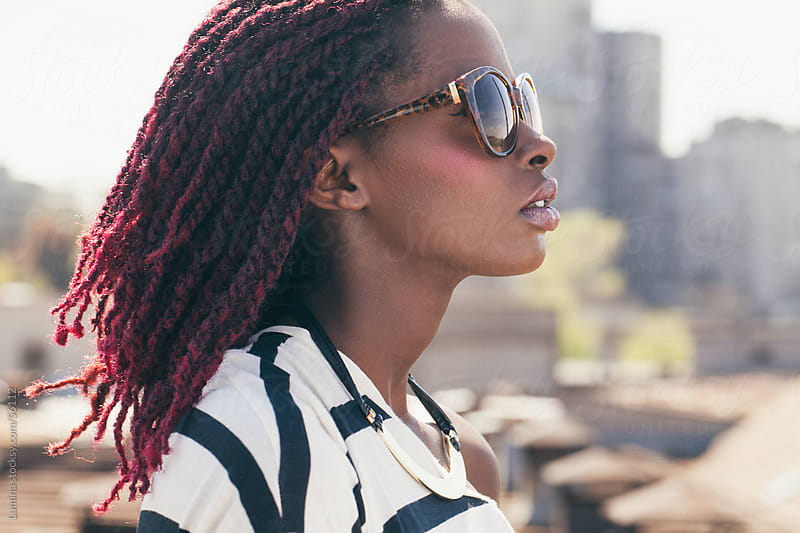 African Woman With Sunglasses And Pink Dreadlocks By Lumina Stocksy 