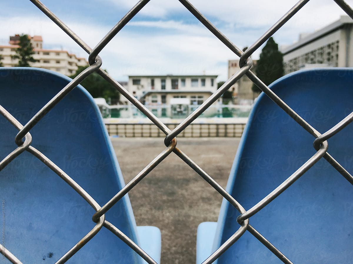 Retro Outdoor Swimming Pool Behind Metal Fence