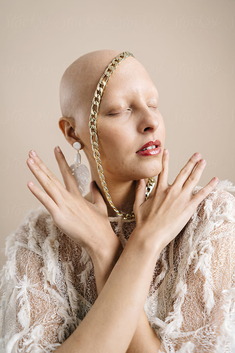 Fashionable bald woman with closed eyes