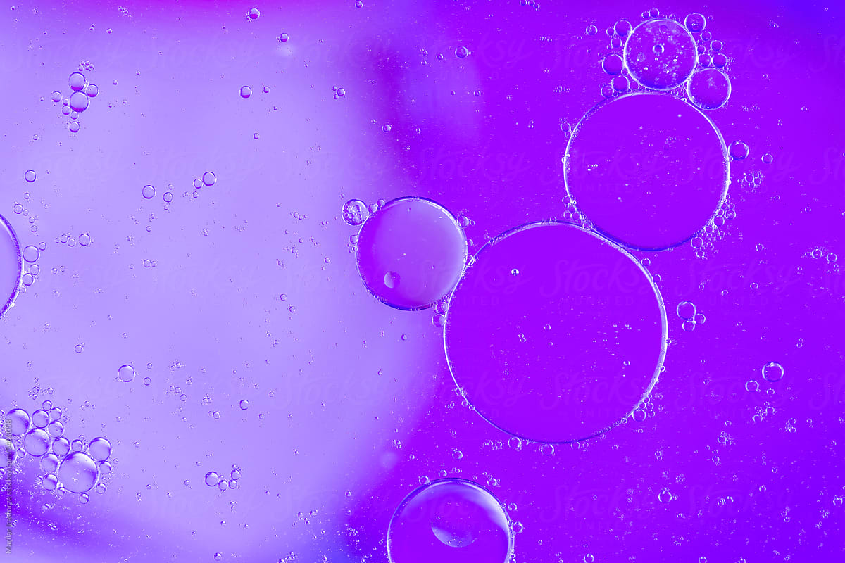 Purple Oil Drops On The Water Surface