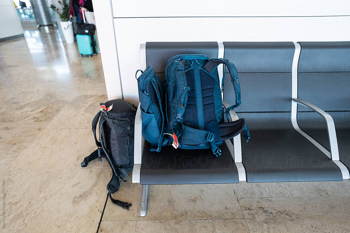 Backpacks at the airport seats.
