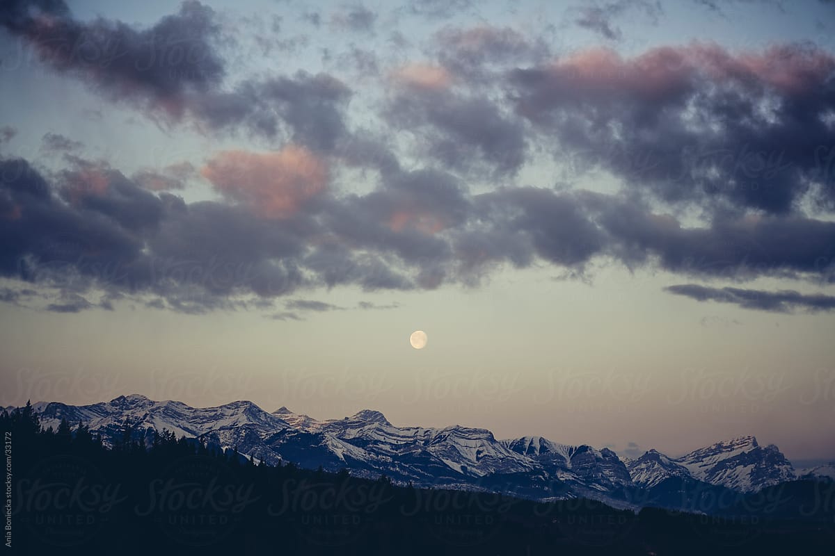 The moon over the mountains at sunrise