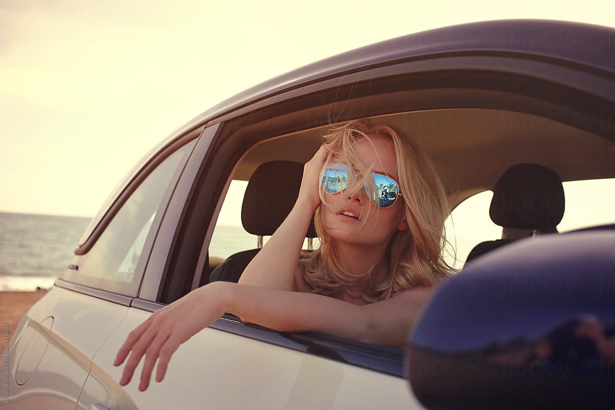 Blonde Female With Sunglasses In Car By Stocksy Contributor Simon Bolz Stocksy