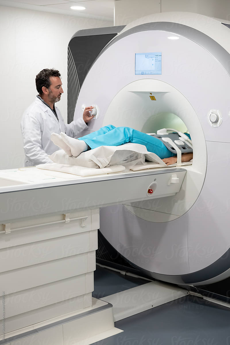 Researcher doing MRI procedure in clinic