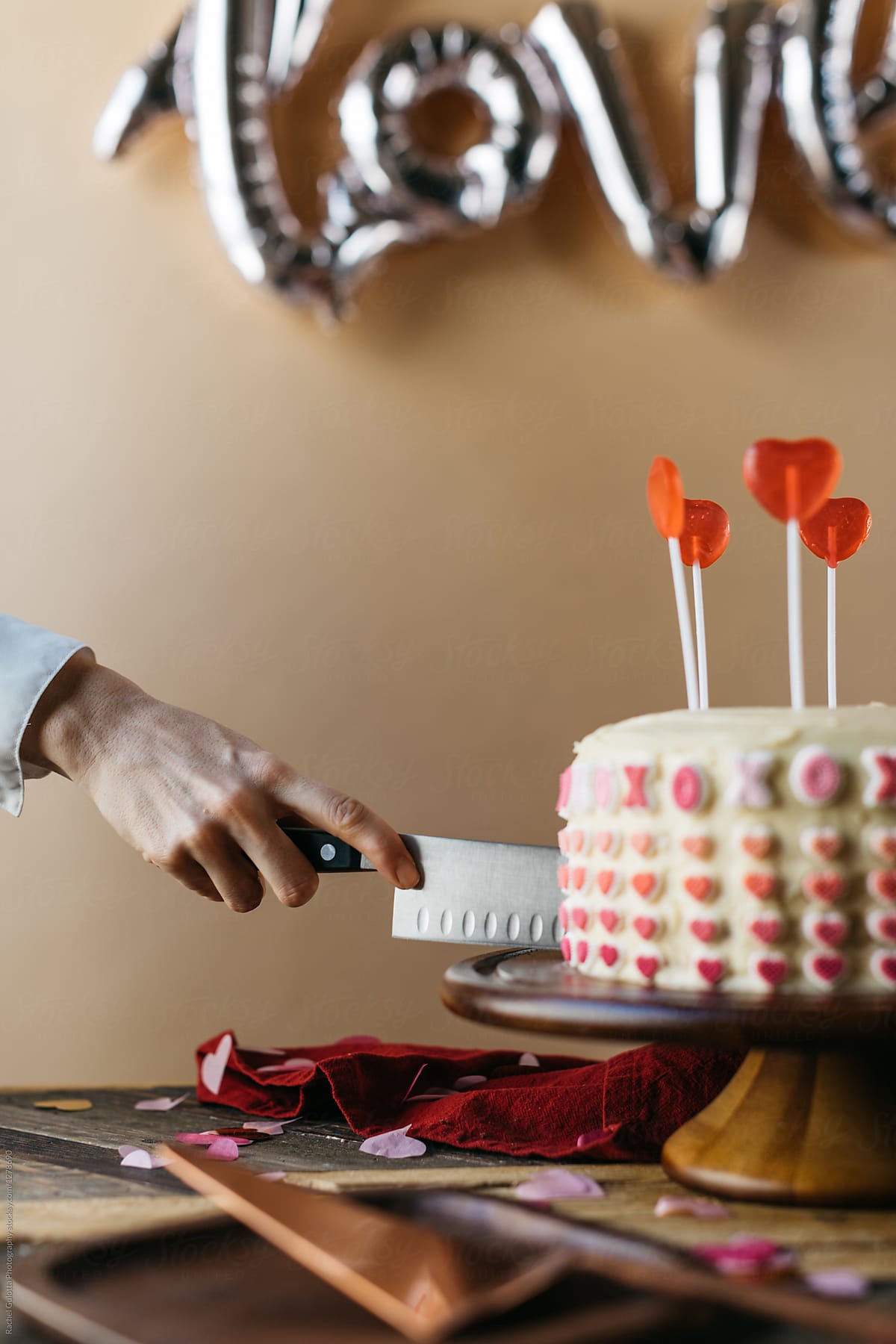 Woman Serving Valentine's Day Cake at Party