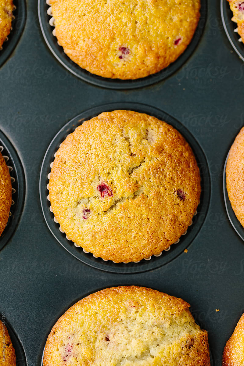 Macro shot of baked raspberry muffin in tin