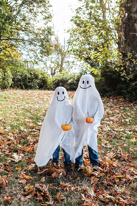 Two Kids in Ghost Costume Celebrating Halloween by Suprijono Suharjoto ...