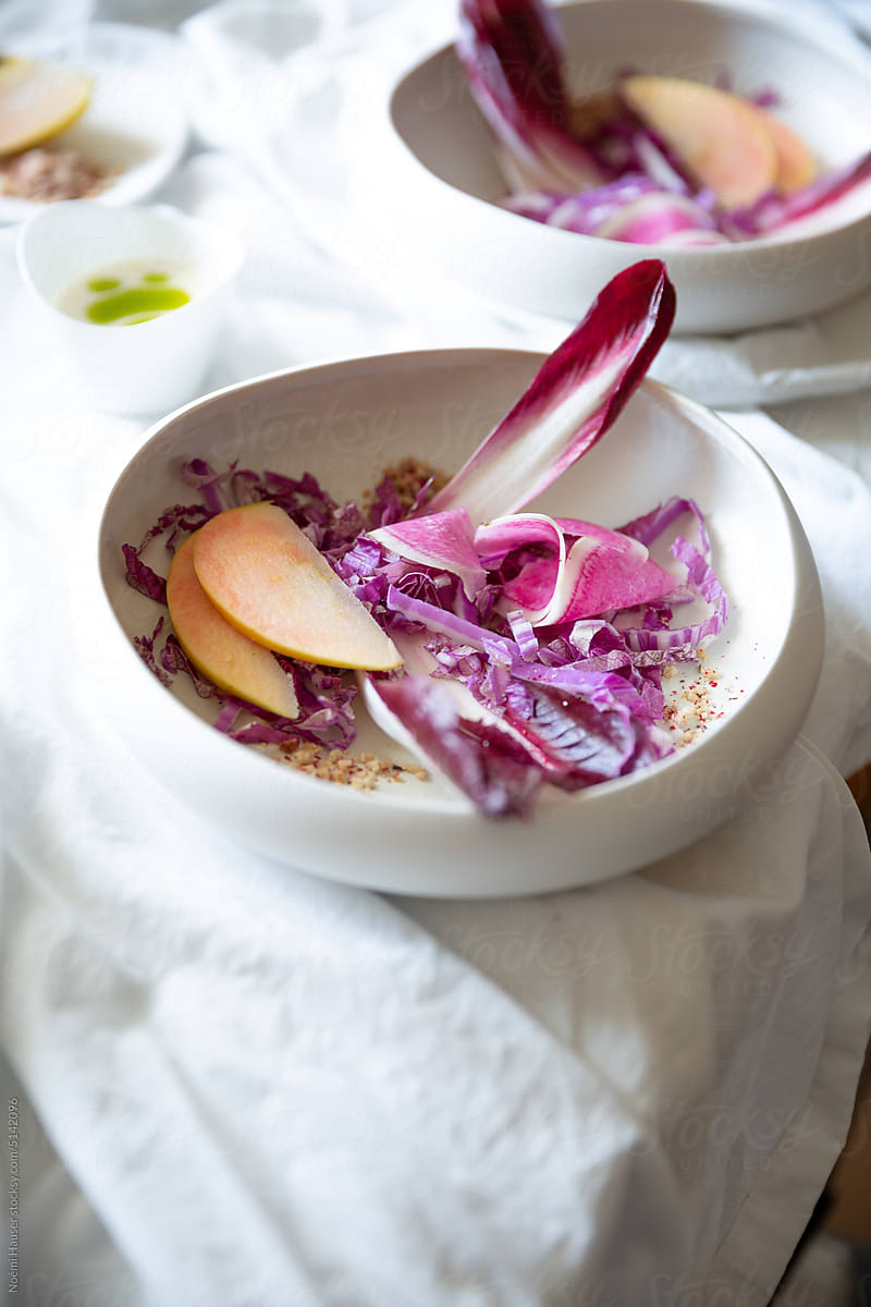 Purple endive salad in white plate