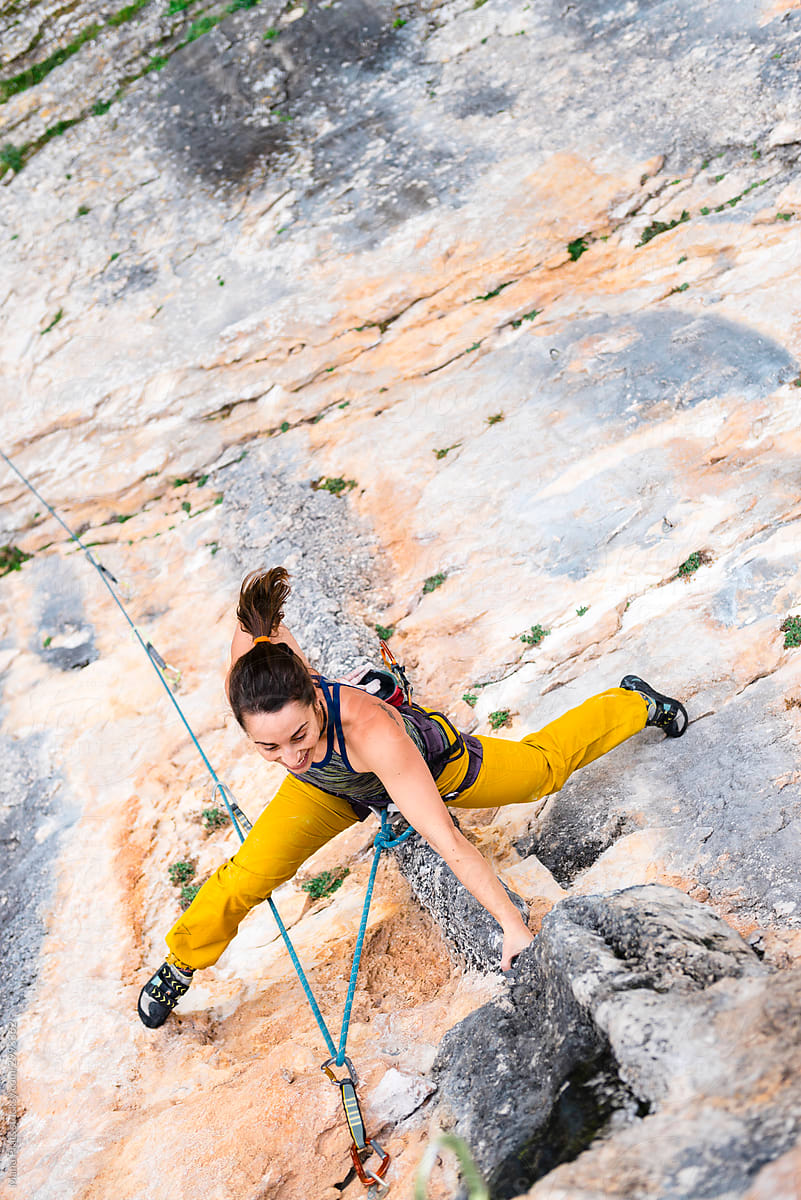 Strong woman rock climbing