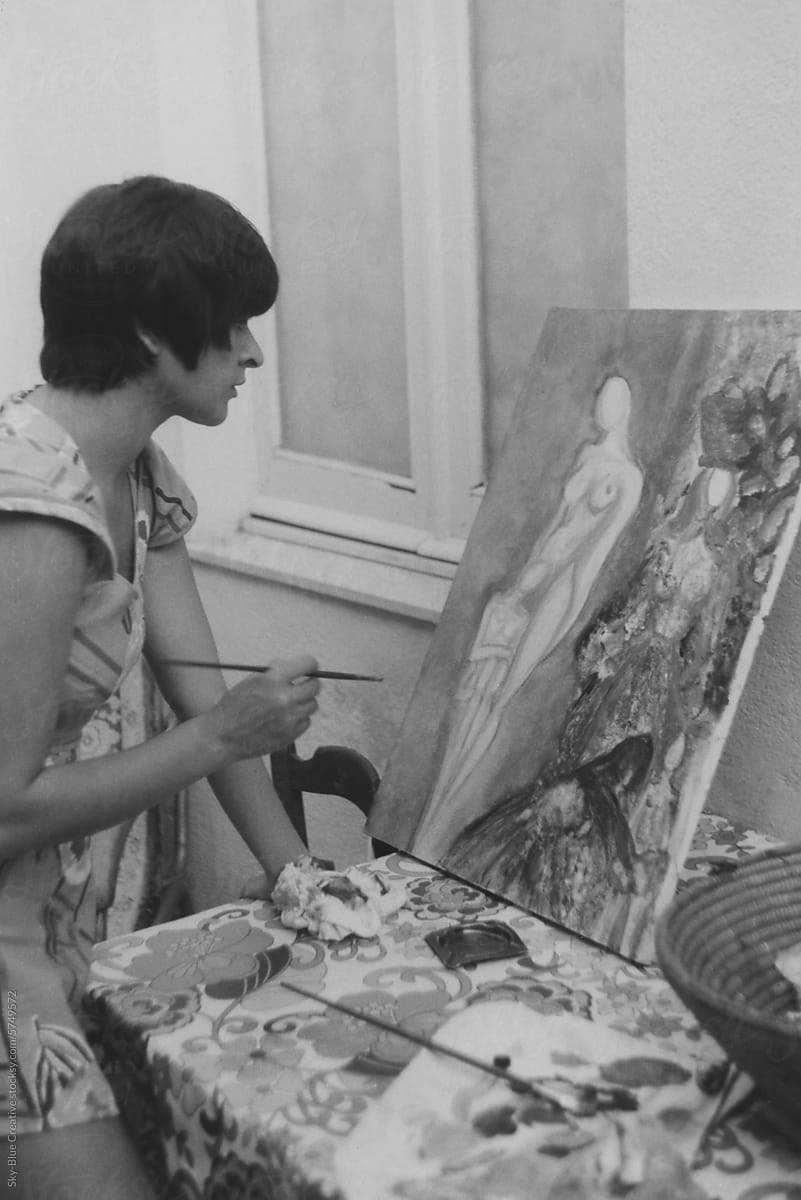 1979. Young painter at work in her studio.