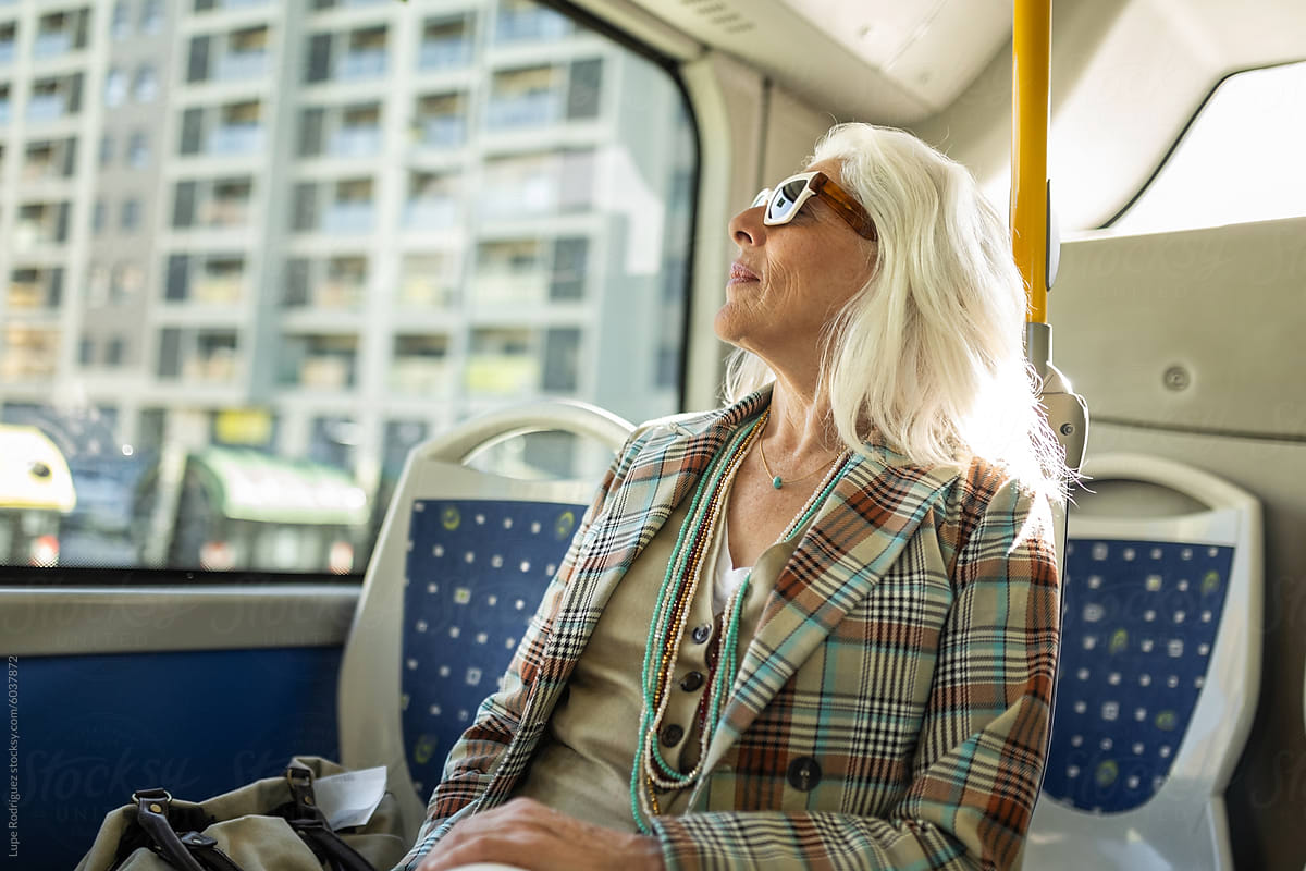 white-haired mature woman on the bus