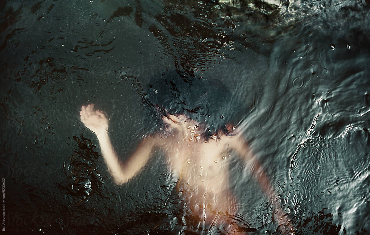 Woman body inside dark waters