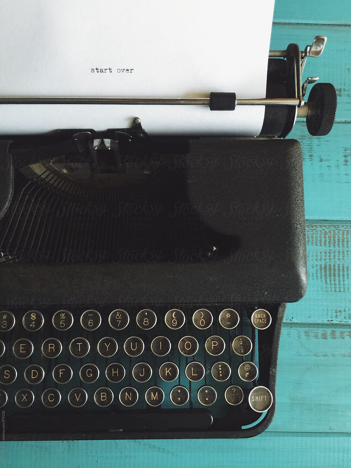 A vintage typewriter that says start over