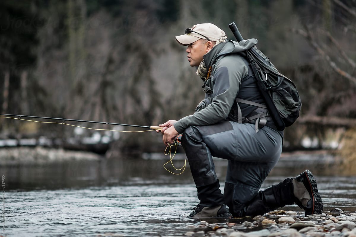 Winter Fly Fishing by Stocksy Contributor Terry Schmidbauer - Stocksy