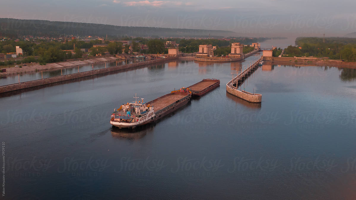 From above view of a barge ship passing by the gateway