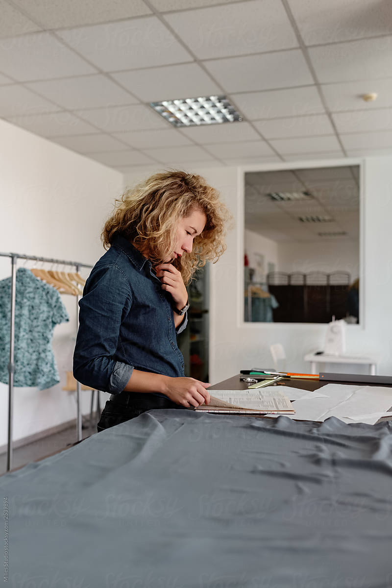 Woman working in dressmaking studio